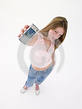 Teenage girl holding up cellular phone