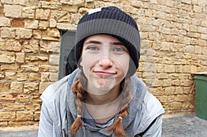 A teenage girl with a knitted hat