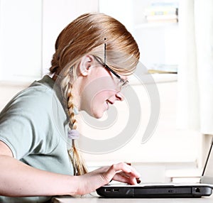 Teenage girl with laptop