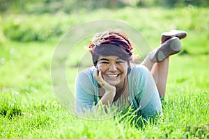 Teenage Girl Laying in Grass