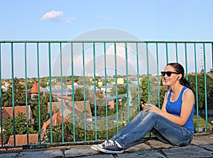 Teenage girl listening music on smart phone