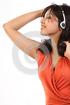 Teenage girl listening to music with earphones