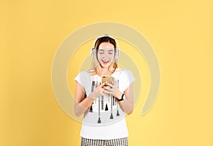 Teenage girl listening to music with headphones