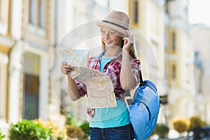 Teenage girl looking at map. Tourism and Vacation concept
