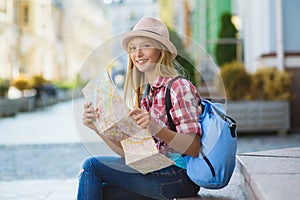 Teenage girl looking at map. Tourism and Vacation concept