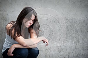 Teenage girl looking thoughtful about troubles