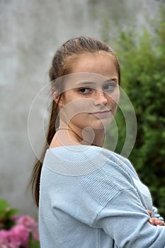 Teenage girl with a lot of freckles