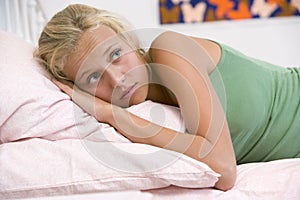 Teenage Girl Lying On Her Bed