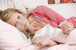 Teenage Girl Lying On Her Bed