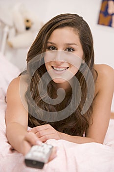 Teenage Girl Lying On Her Bed Changing