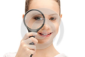 Teenage girl with magnifying glass