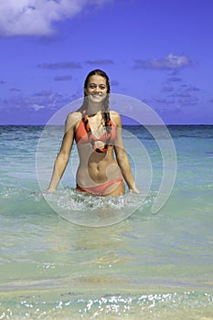 Teenage girl in the ocean in hawaii