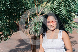 Teenage girl in the park. Portrait of a beautiful young teenage girl on a sunny day