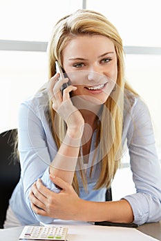 Teenage girl with phone in class