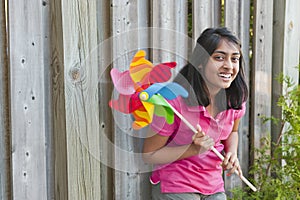 Teenage girl with pinwheel