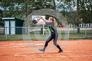 Teenage girl playing fastball