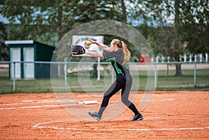 Teenage girl playing fastball photo
