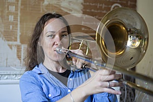 Teenage girl playing the trombone