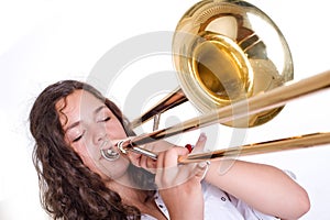 Teenage girl playing the trombone