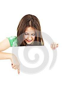 Teenage girl pointing at a blank board