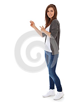 Teenage girl pointing to the side