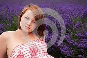 Teenage girl posing against lavender field