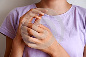 Teenage girl practicing EFT tapping or emotional freedom technique