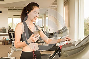 Teenage girl prepare for exercise on running machine