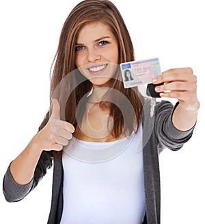 Teenage girl proudly showing her driver licence