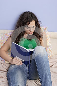 Teenage girl reading a book