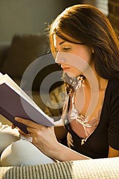 Teenage girl reading book