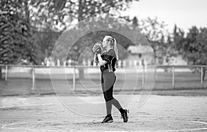 Teenage girl ready to pitch a fastball photo