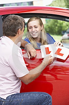 Teenage Girl Receiving Her Learner Plates