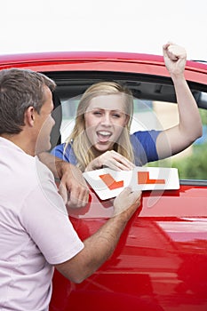 Teenage Girl Receiving Her Learner Plates