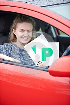 Teenage Girl Recently Passed Driving Test Holding P Plates