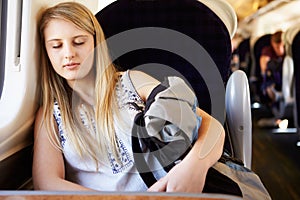 Teenage Girl Resting On Train Journey