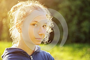 Teenage girl restrained smile in front of camera