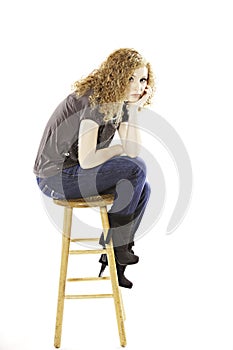 Teenage Girl Seated on Stool