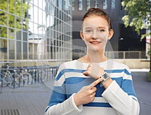teenage girl showing smart watch with qr code
