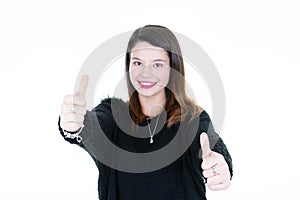 Teenage girl showing thumbs up with both hands