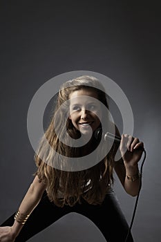 Teenage Girl Singing Into Microphone