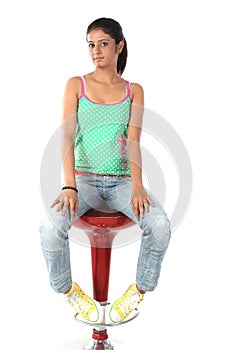 Teenage girl sitting on chair photo