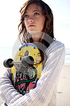 Teenage girl with skate board