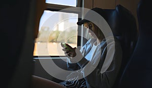 Teenage girl with smartphone travelling
