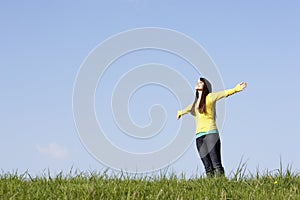 Teenage Girl Standing in Summer Meadow