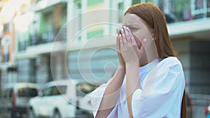 Teenage girl starting to cough trying to inhale, contaminated air, pollution