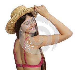 Teenage girl with sun protection cream on her back against white background