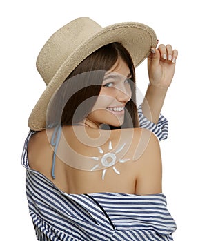 Teenage girl with sun protection cream on her back against white background