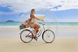 Teenage girl with surfboard and bike