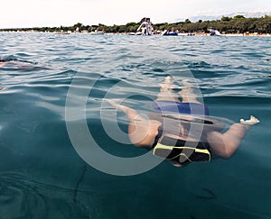 A teenage girl with swim mask under water in Adriaticsea photo